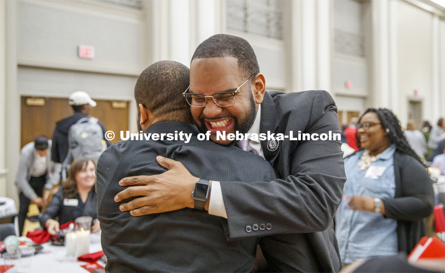 Maurice Stinnett, Vice President for Diversity and Inclusion with the BSE Global, hugs Calvin Sandidge following Stinnett's key-note at the State of Diversity summit. October 29, 2019. Photo by Craig Chandler / University Communication.