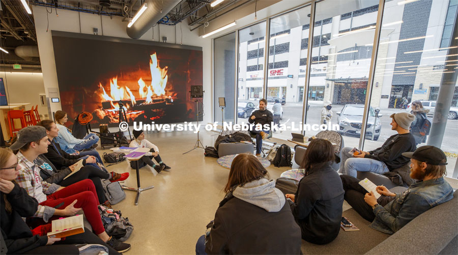 Hot learning on a cold day. Video of a fireplace takes the chill off as Jesse Fleming leads a discussion during his EMAR 140 - Visual Expression Studio course in the Johnny Carson Center for Emerging Arts. Snow on campus. October 30, 2019. Photo by Craig Chandler / University Communication.