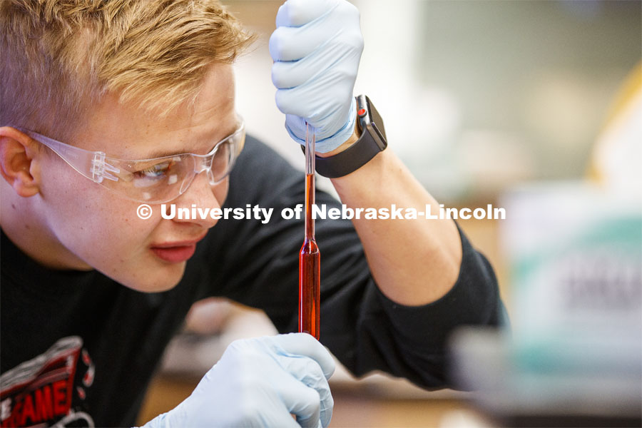 Chem 109 lab, students draw up liquids to determine absorption spectra and best wavelengths in different food dyes. Chemistry Lab in Hamilton Hall. November 7, 2019. Photo by Craig Chandler / University Communication.