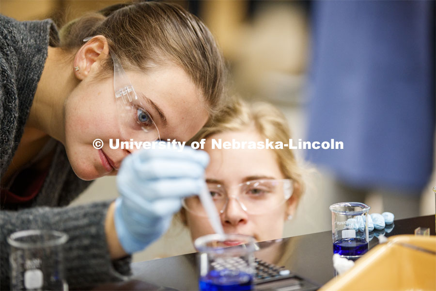 Sydney Kimnach and her lab partner, Emmalise Meyer, dilute liquids in a Chem 109 lab to determine absorption spectra and best wavelengths in different food dyes. Chemistry Lab in Hamilton Hall. November 7, 2019. Photo by Craig Chandler / University Communication.