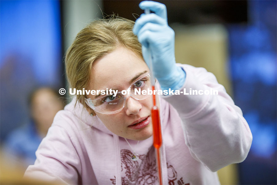 Emmalise Meyer draws up liquids in a Chem 109 lab to determine absorption spectra and best wavelengths in different food dyes. Chemistry Lab in Hamilton Hall. November 7, 2019. Photo by Craig Chandler / University Communication.