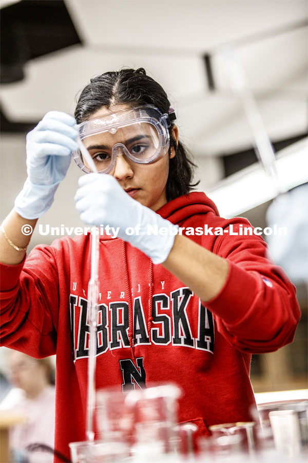 Sophia Deras measures her solution in a Chem 109 lab to determine absorption spectra and best wavelengths in different food dyes. Chemistry Lab in Hamilton Hall. November 7, 2019. Photo by Craig Chandler / University Communication.