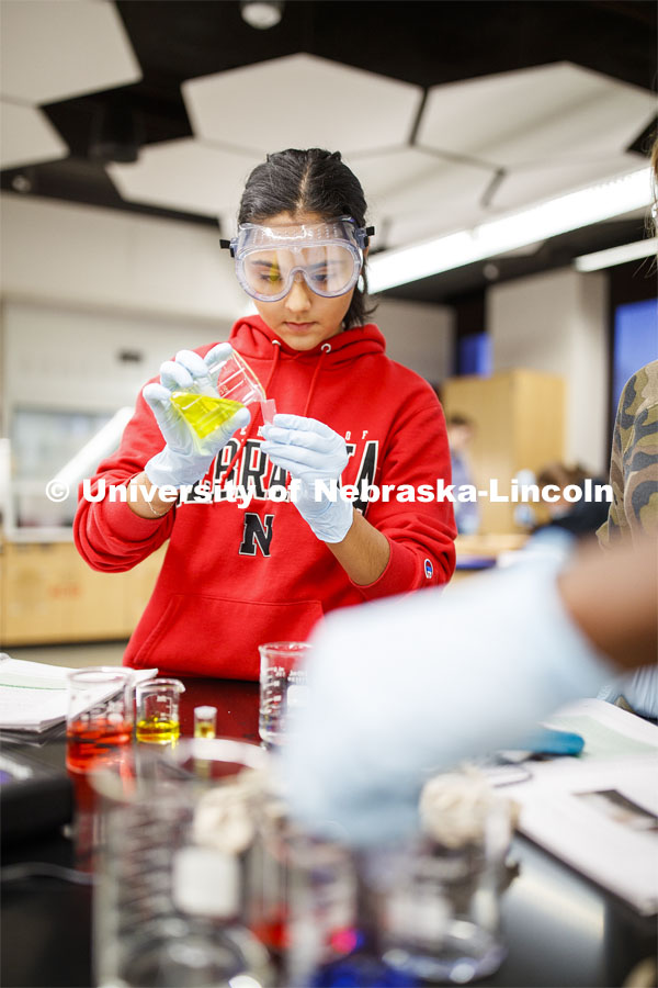 Sophia Deras transfers her solution in a Chem 109 lab to determine absorption spectra and best wavelengths in different food dyes. Chemistry Lab in Hamilton Hall. November 7, 2019. Photo by Craig Chandler / University Communication.