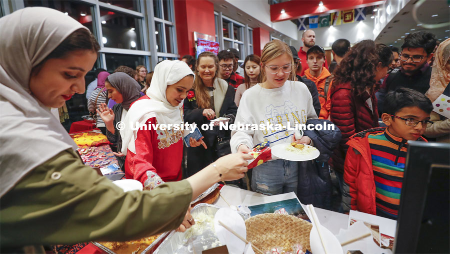 The lines were long and deep to sample cultural food at the various booths including the Oman student group booth. Global Huskers Festival, a multicultural festival provides attendees the chance to explore the world through informational booths that will have food, cultural décor, art, and more, each hosted by UNL students from those culture. November 19, 2019. Photo by Craig Chandler / University Communication.