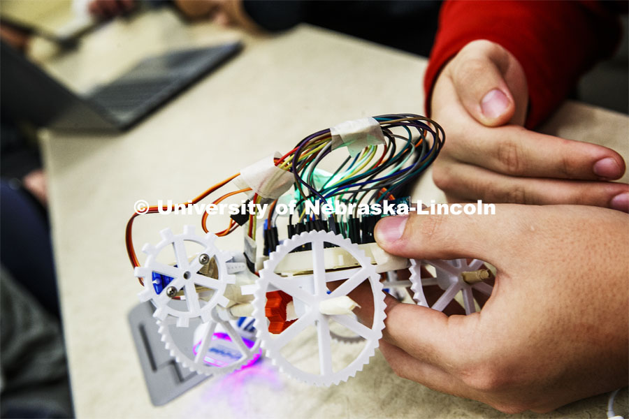 Students in Mark Bauer ECEN 102 - Introduction to Electrical Engineering class work on small robots they build and program to deliver a plastic cube along a specific path. November 20, 2019. Photo by Craig Chandler / University Communication.