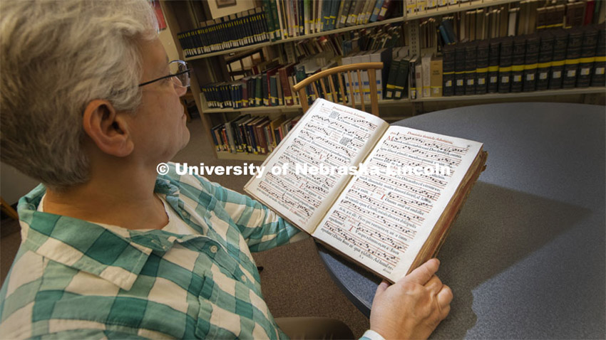 Anita Breckbill, professor and music librarian at the University of Nebraska–Lincoln, looks through “Antiphonarium Romanum,” a 405-year-old book of Gregorian chants that was recently donated to Archives and Special Collections by Karen R. Lusk. The only other known copy is located at Yale University. November 22, 2019. Photo by Gregory Nathan / University Communication.