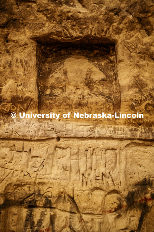A rendering of the Sphinx is among thousands of names carved on the sandstone walls. Professor Ricky Wood uses LIDAR to digitally map Robbers Cave in Lincoln. November 22, 2019. Photo by Craig Chandler / University Communication.