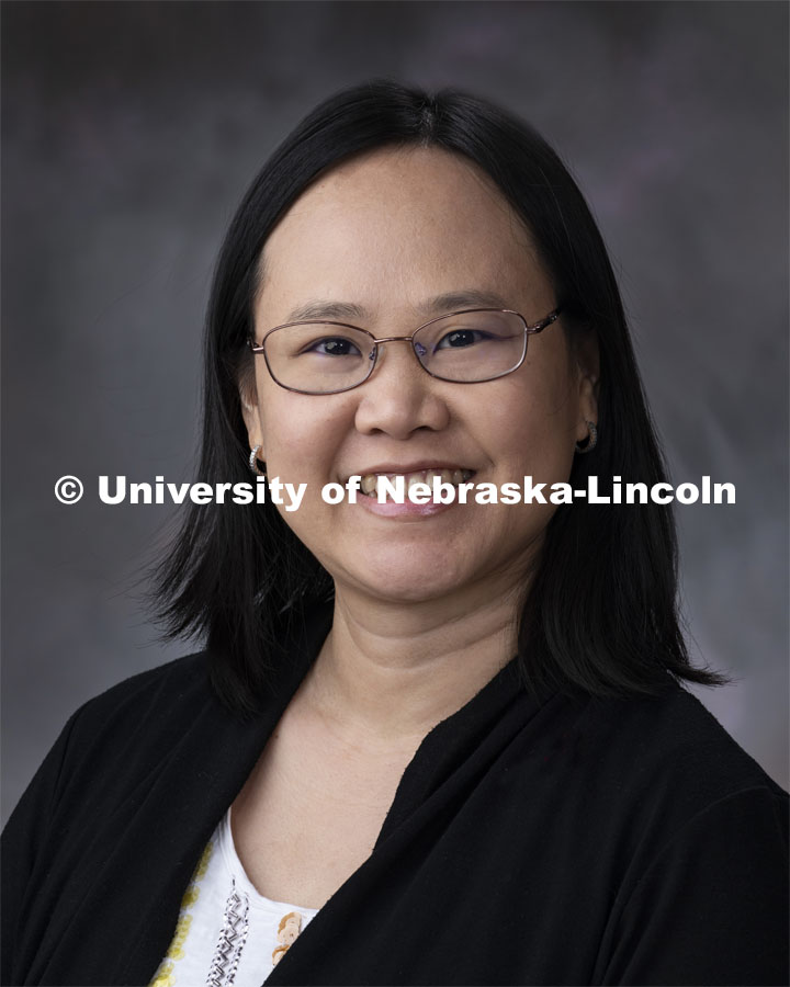 Studio portrait of Mai Dang, Financial Associate for the Animal Science Business Center. November 26, 2019. Photo by Gregory Nathan / University Communication.