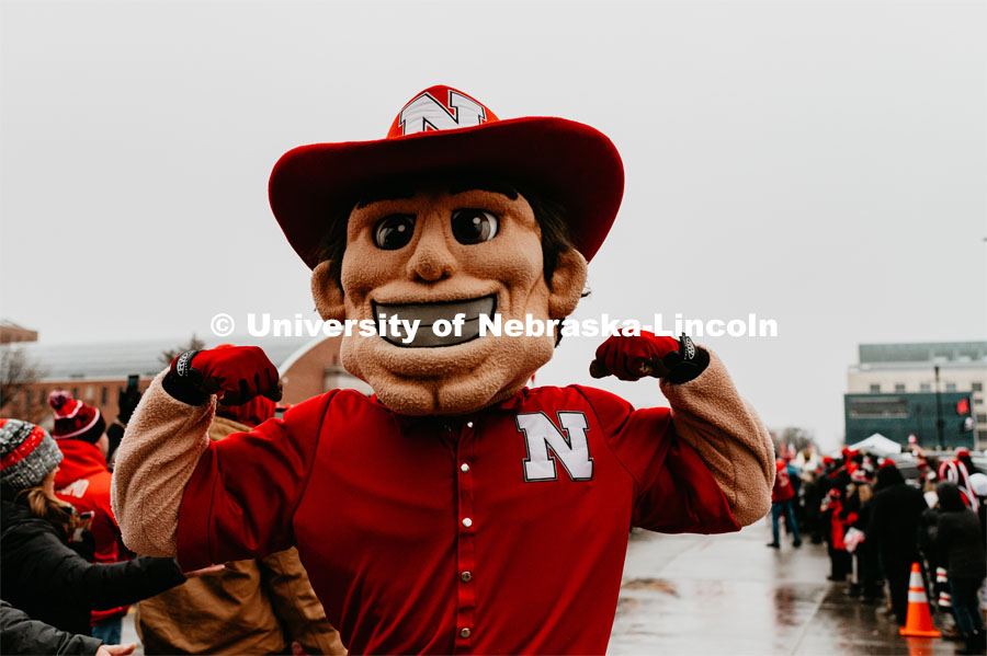 Herbie flexing his muscles at unity walk. Nebraska vs. Iowa State University football game. November 29, 2019. Photo by Justin Mohling / University Communication.