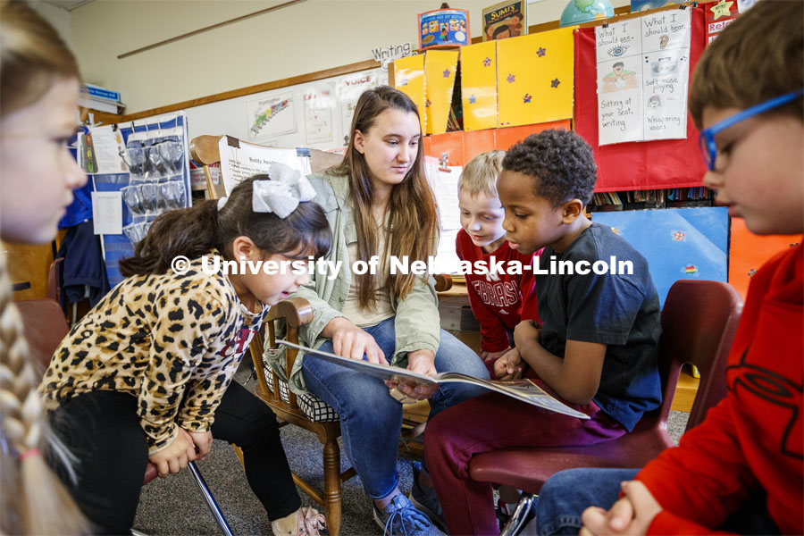 Megan Groth, sophomore in Speech-Language Pathologist, reads to first graders at Saratoga Elementary school as part of the America Reads / America Counts project. December 5, 2019. Photo by Craig Chandler / University Communication.