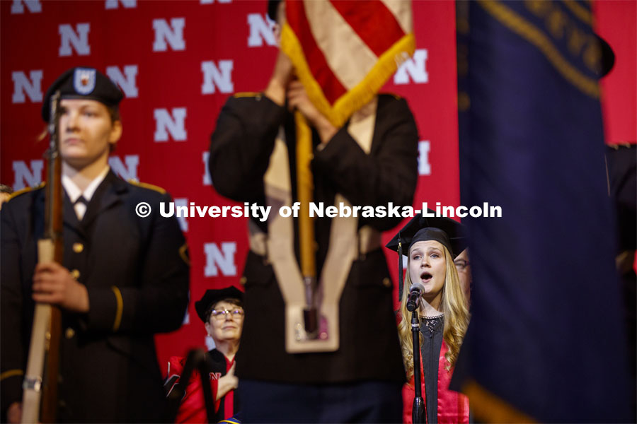 Susan Tweihaus, sings the national anthem at the December Undergraduate commencement at Pinnacle Bank Arena. December 21, 2019. Photo by Craig Chandler / University Communication.