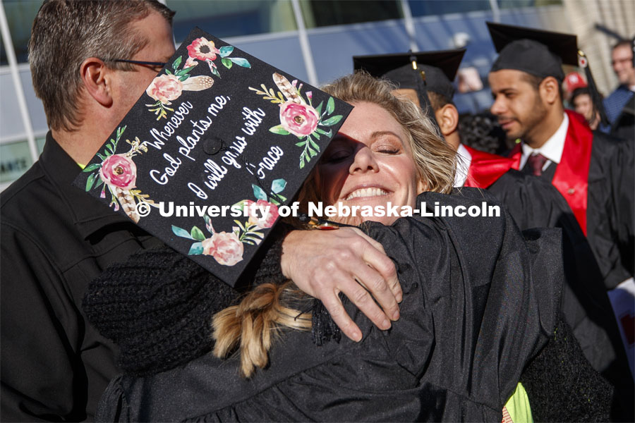 Alyssa Arndt is hugged by her mom, Jen, after the commencement. December Undergraduate commencement at Pinnacle Bank Arena. December 21, 2019. Photo by Craig Chandler / University Communication.