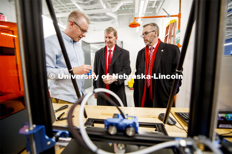 Shane Farritor shows NU President Ted Carter and UNL Chancellor Ronnie Green a 3D printed part for his Virtual Incisions robot. Farritor is a Professor of Mechanical and Materials Engineering and founder of Virtual Incision which is housed at NIC's RISE building. NU President Ted Carter tours UNL campuses. January 16, 2020. Photo by Craig Chandler / University Communication.