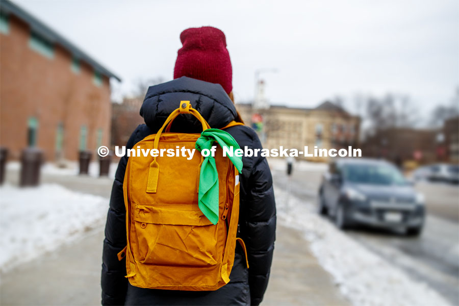 A new campaign, the Bandana Project, will launch at the University of Nebraska—Lincoln to provoke conversations about mental health and promote resources available to help students. Camille Paddock wears a green bandana on her backpack to show support for mental health awareness. The Bandana Project is a program designed to spread awareness of resources for those with mental illness. Green bandanas are attached to students’ backpacks. This indicates that they are a safe individual to approach with mental health-related issues, that they know where resources are, and that they hold a few resource cards. January 21, 2020. Photo by Craig Chandler / University Communication.