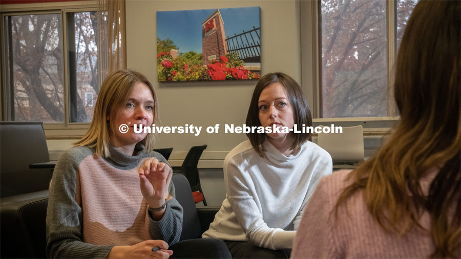 Rebecca Brock, assistant professor of psychology (in white), and graduate student Frannie Calkins (in pink and gray), interview a student. Their latest research suggests that even well-intentioned, healthy support — being helpful, encouraging and a good listener — can be counterproductive. Their research findings “The dark side of helping behaviors” was published in the Journal of Social and Personal Relationships. January 31, 2020. Photo by Gregory Nathan / University Communication.