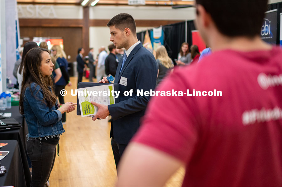 Student Nick Vetter talking with Nelnet. Employers are able to talk with students about possible employment at the Spring University Career Fair in the Nebraska Union. February 11, 2020. Photo by Justin Mohling / University Communication.