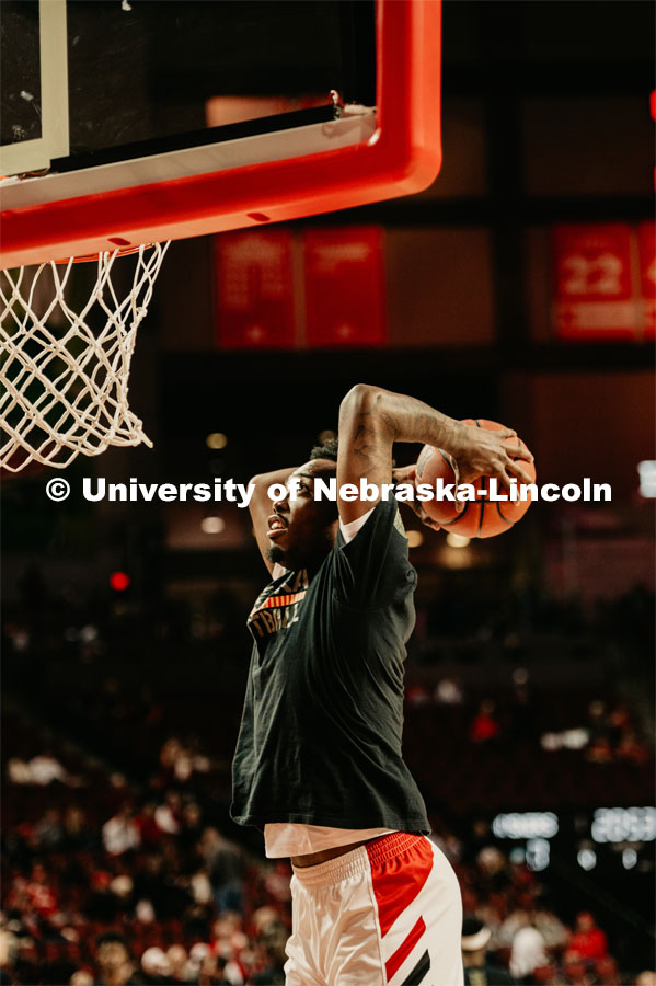 Jervay Green warms up by slam dunking a ball. Nebraska vs. Wisconsin State University men’s basketball game. February 15, 2020. Photo by Justin Mohling / University Communication.