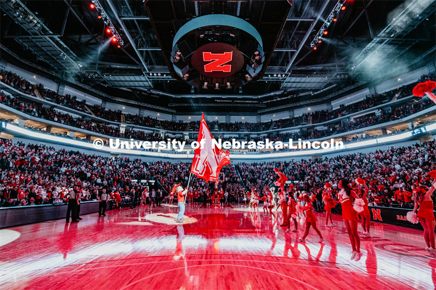 Herbie holds a large N flag while the spirit team rallies the crowd during the pregame light show. Nebraska vs. Wisconsin State University men’s basketball game. February 15, 2020. Photo by Justin Mohling / University Communication.