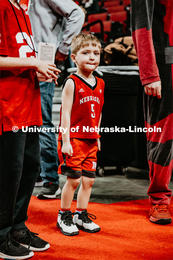 A young Husker fan waits for the basketball team to come through the tunnel walk. Nebraska vs. Michigan State University men’s basketball game. February 20, 2020.  Photo by Justin Mohling / University Communication.