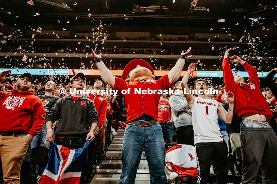 The first point is scored, and Herbie and the student section throws torn up Daily Nebraskan newspapers. Nebraska vs. Michigan State University men’s basketball game. February 20, 2020.  Photo by Justin Mohling / University Communication.