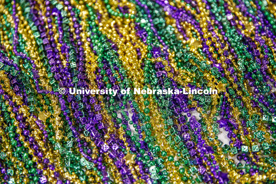 Pictured; a pile of Mardi Gras beads. Mardi Gras special meal at East Campus Dining Center. February 25, 2020. Photo by Craig Chandler / University Communication.