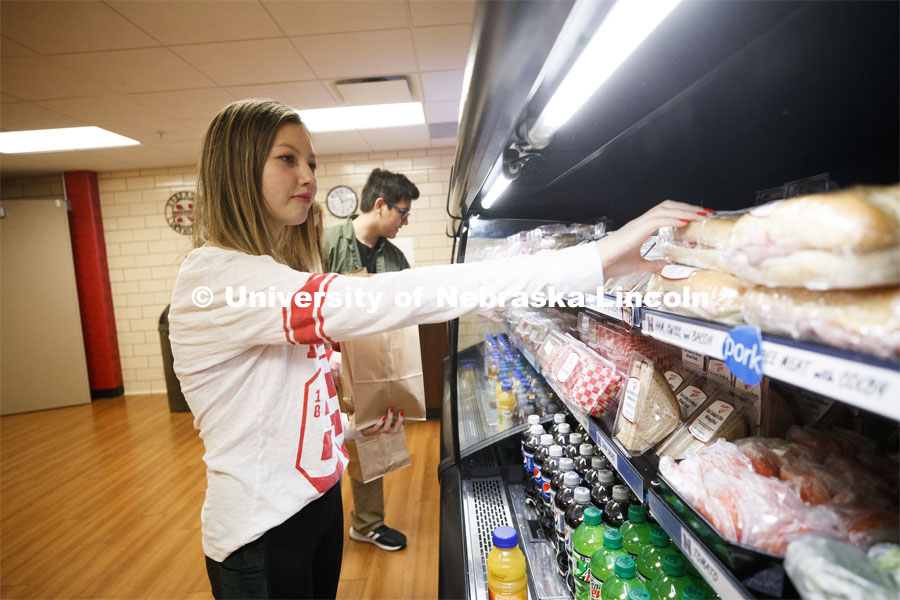 Selleck Dining Center photo shoot. Students select food out of the food cooler at Herbie's Market in Selleck Dining Center. March 5, 2020. Photo by Craig Chandler / University Communication.