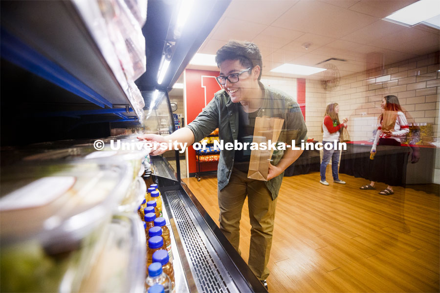 Selleck Dining Center photo shoot. Students select food out of the food cooler at Herbie's Market in Selleck Dining Center. March 5, 2020. Photo by Craig Chandler / University Communication.