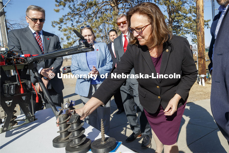 Senator Deb Fischer looks over auger bits used by NIMBUS Lab drones to implant remote sensors. Senator Deb Fischer was given a demonstration of the drilling drone as part of her tour at UNL Friday afternoon. March 6, 2020. Photo by Craig Chandler / University Communication.