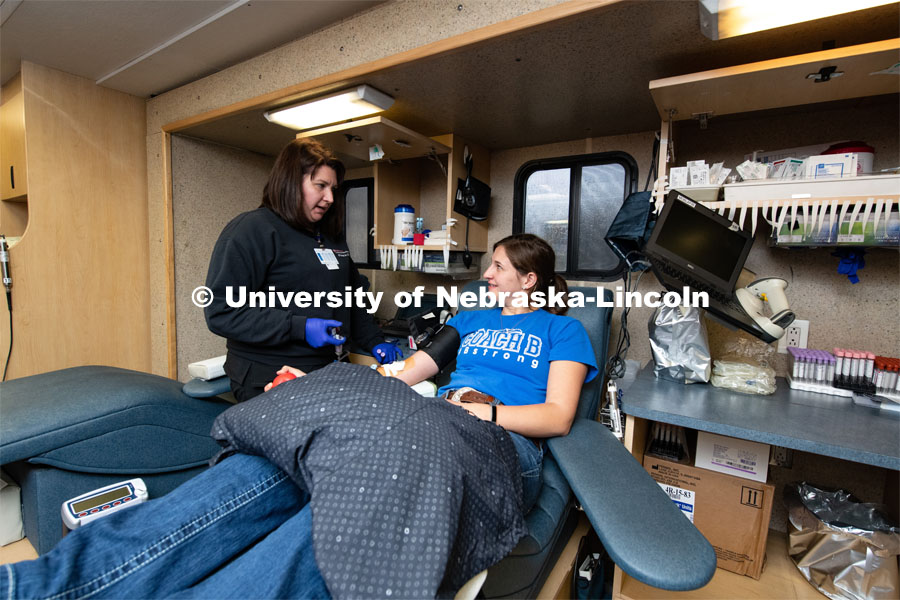 Heidi, of the Community Blood Bank, preps Fina Choat of St Edward, a Senior Pre-Veterinary Medicine Student, to donate blood. March 9, 2020. Photo by Gregory Nathan / University Communication.
