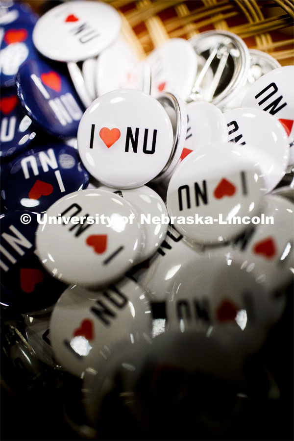 NU Advocacy Day at the Capitol. A pile of I Love NU buttons. March 10, 2020. Photo by Craig Chandler / University Communication.