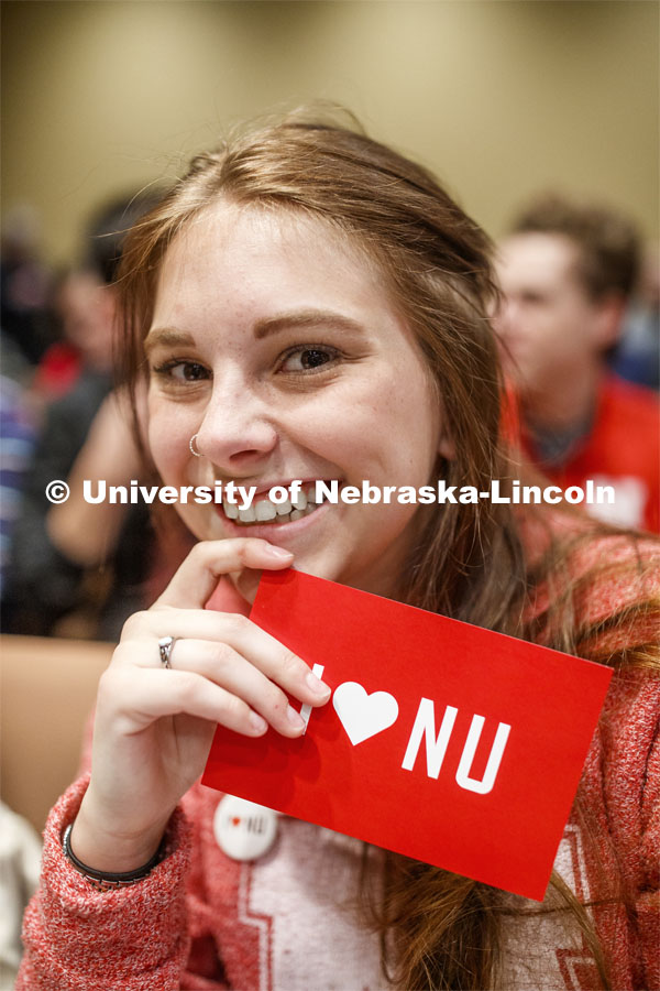 Sheridan Macy, a senior in political science and history, shows off her "I love NU" postcard at the NU Advocacy Day in the Capitol. March 10, 2020. Photo by Craig Chandler / University Communication.