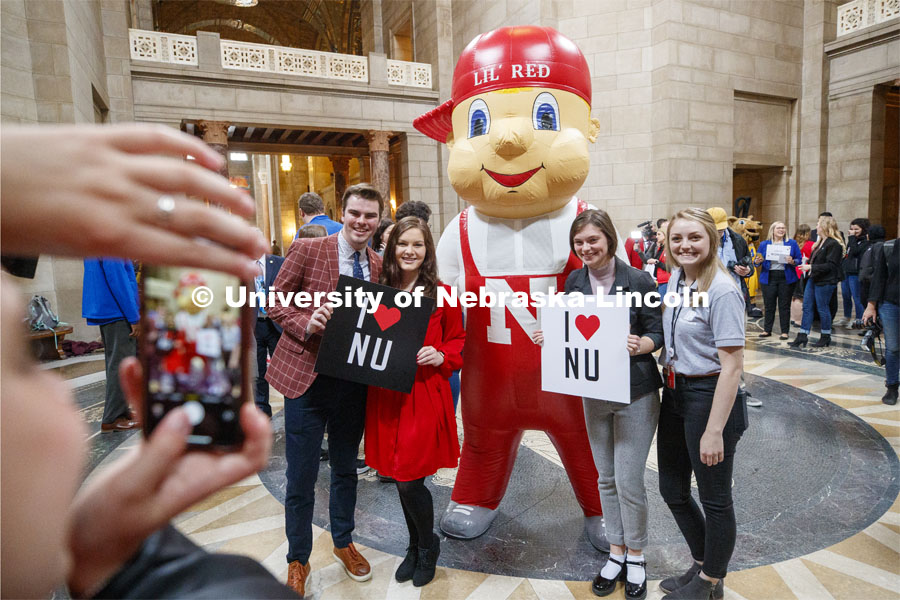 Lil' Red poses with UNL students in the rotunda. NU Advocacy Day at the Capitol. March 10, 2020. Photo by Craig Chandler / University Communication.