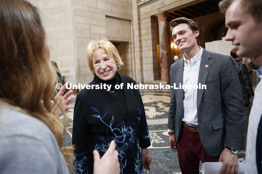 Senator Lou Linehan talks with students including, at right, Drew Harrahill, a senior in biochemistry from Elkhorn, in the rotunda. NU Advocacy Day at the Capitol. March 10, 2020. Photo by Craig Chandler / University Communication.