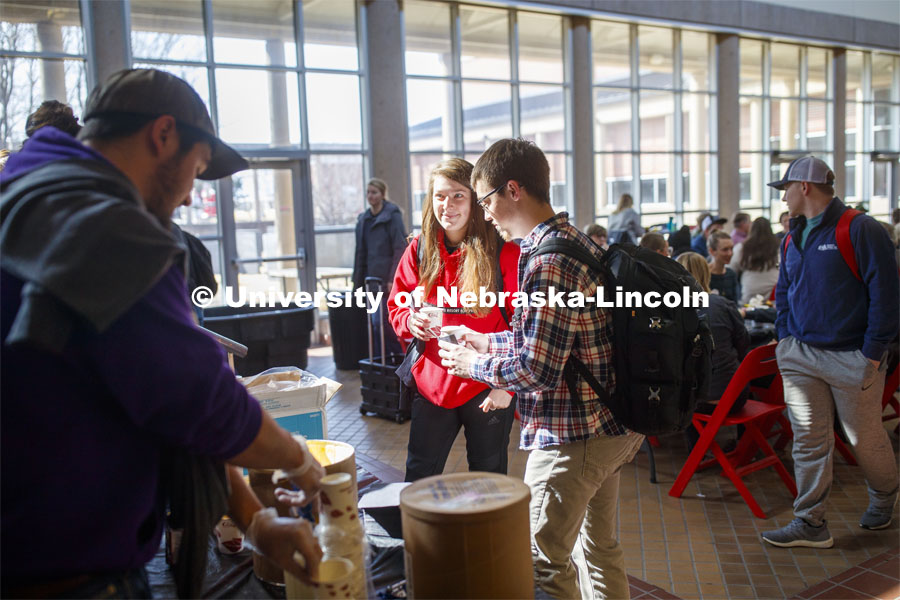 Miranda Mueller smiles after getting a root beer float as part of Lunch In The Lobby in the Animal Science building lobby, a part of CASNR week. March 11, 2020. Photo by Craig Chandler / University Communication.