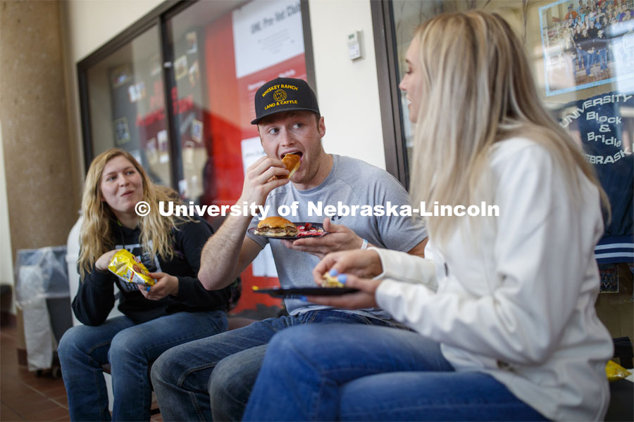 Sloane Tiarks, Chad Bode and Rachel Stewart enjoy lunch Wednesday. Lunch In The Lobby in the Animal Science building lobby is part of CASNR week. March 11, 2020. Photo by Craig Chandler / University Communication.