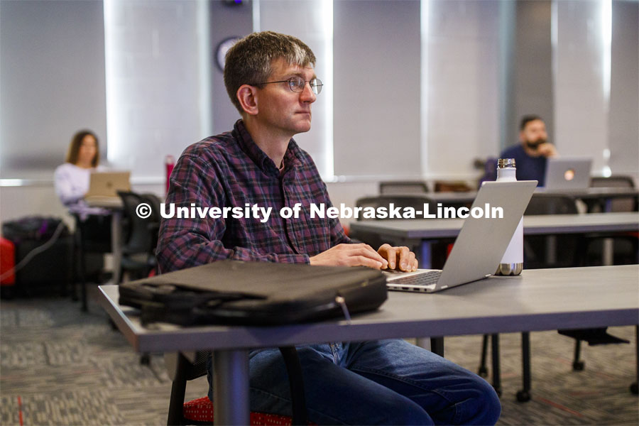Chad Brassil, associate professor of biological sciences, listens as instructional designers from the Center for Transformative Teaching present ideas for a smooth transition to remote learning during a March 17 session. The center is offering a one-week, spring break course to help instructors overcome remote teaching challenges. Learn more at https://go.unl.edu/rm4z. City Campus. March 17, 2020. Photo by Craig Chandler / University Communication.