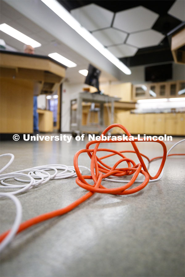 Chemistry labs become recording studios as connecting cables coil across the floor connecting computers, monitors and cameras. As a result of the Corona virus, Faculty are recording Chemistry labs in Hamilton Hall to prepare for the start of remote learning. March 24, 2020. Photo by Craig Chandler / University Communication.