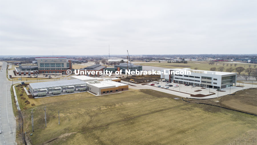 Excavators are busy moving piles of dirt where a new Hotel will be built on Nebraska Innovation Campus (open space center of the photo). March 24, 2020 Photo by Craig Chandler / University Communication.