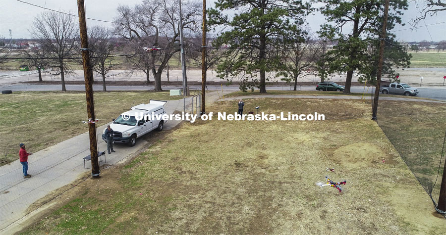 Carrick Detwiler and his students from the NIMBUS Lab work with several drones flying with each other in the new NIC outdoor flying facility at Nebraska Innovation Campus. March 24, 2020. Photo by Craig Chandler / University Communication.