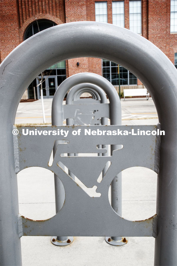 An empty bicycle rack sits outside the Food Innovation Center at Nebraska Innovation Campus. March 25, 2020. Photo by Craig Chandler / University Communication.