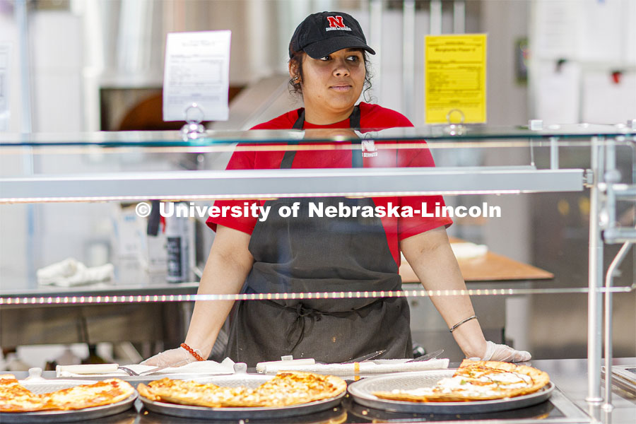 Anagha Deshmankar is a student worker in the Willa Cather Dining Center on City Campus. April 7, 2020. Photo by Craig Chandler / University Communication.