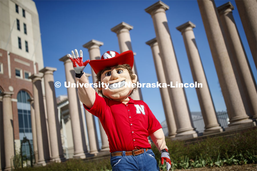 Herbie Husker in front of the columns by Memorial Stadium. On campus. April 30, 2020. Photo by Craig Chandler / University Communication.