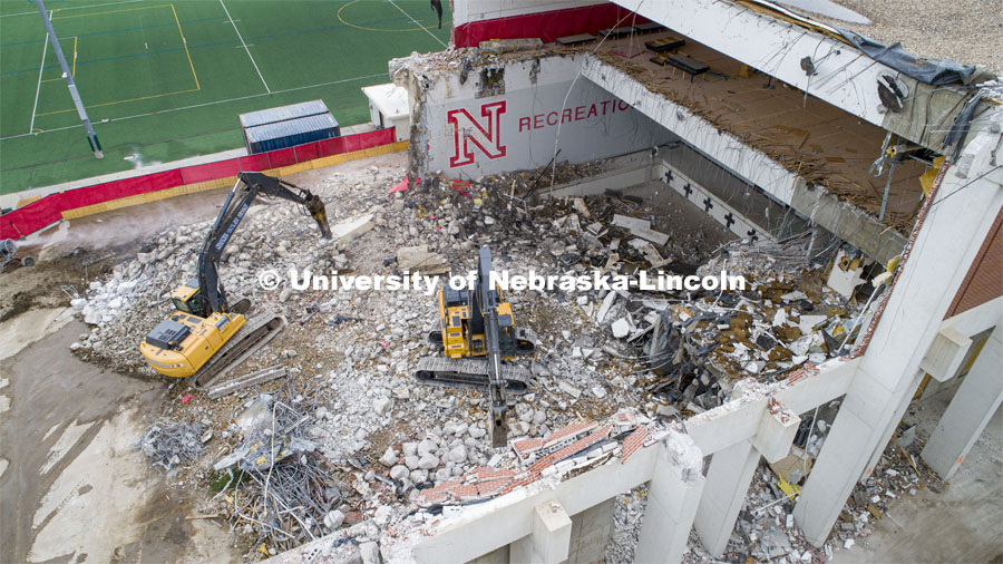 No diving into the pool as the Mabel Lee Hall demolition crew works from the north end of the building. May 11, 2020. Photo by Craig Chandler / University Communication.