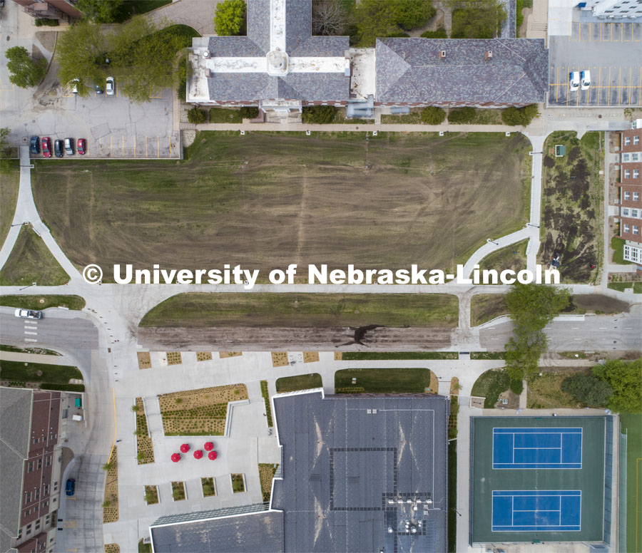 Aerial view of Raymond and Heppner Halls, The Courtyards, Tennis Courts, Willa Cather Dining Complex, and Robert Knoll Residential Center. Drone photo is a composite of multiple images because of 400' ceiling for UAV flights. City Campus aerials. May 12, 2020. Photo by Craig Chandler / University Communication