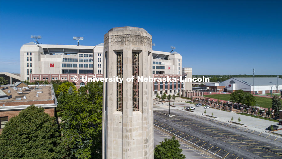 Mueller Bell Tower with Memorial Stadium in the background. Drone footage of City Campus. May 29, 2020. Photo by Craig Chandler / University Communication.