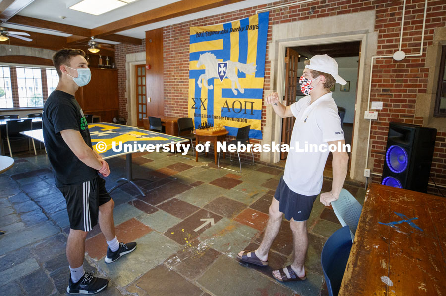 Noah Wilger, sophomore from Lincoln, gives a tour to incoming freshman Joe Vacek. Sigma Chi recruitment day. Sigma Chi members are wearing masks as a result of the COVID-19 pandemic. May 29, 2020. Photo by Craig Chandler / University Communication.