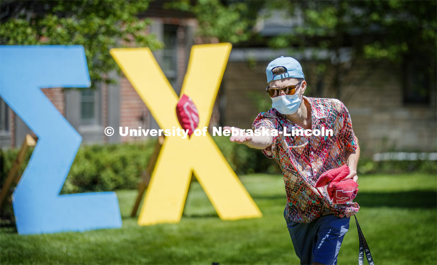 Sigma Chi members play Corn Hole on recruitment day. Sigma Chi members are wearing masks as a result of the COVID-19 pandemic. May 29, 2020. Photo by Craig Chandler / University Communication.