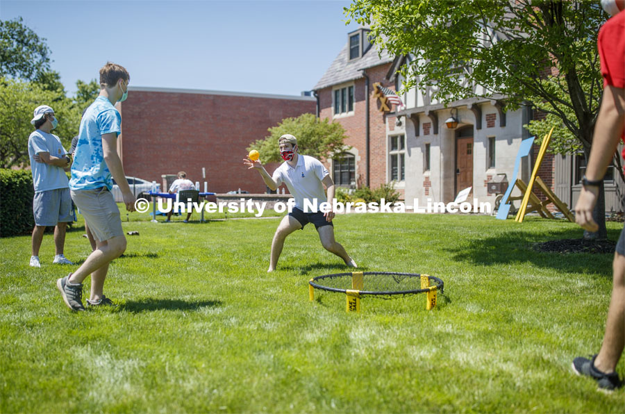 Alex Cathcart, a junior from Northridge, CA, plays spike ball with others during Sigma Chi recruitment day. Sigma Chi members are wearing masks as a result of the COVID-19 pandemic. May 29, 2020. Photo by Craig Chandler / University Communication.