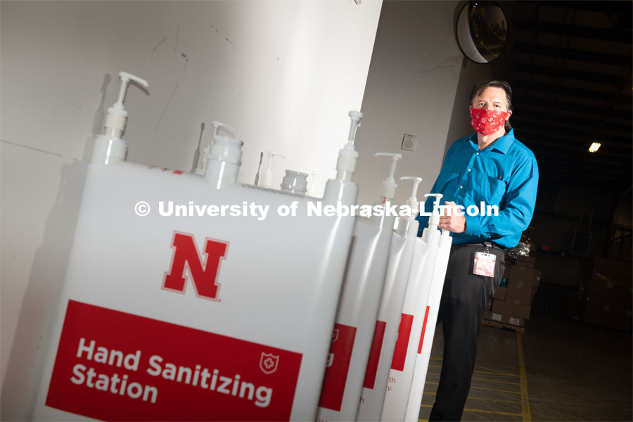 Jim Jackson, associate vice chancellor of University Operations, put a team together to solve the problem of efficiently distributing hand sanitizer across campus. They invented the large-capacity, free-standing dispenser station shown here. June 8, 2020. Photo by Greg Nathan / University Communication.