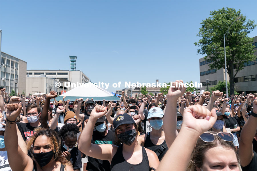 Protestors raise their fists in the air during a moment of silence outside of the Nebraska State Capitol on Saturday, June 13th, 2020, in Lincoln, Nebraska. Black Lives Matter Protest. Photo by Jordan Opp for University Communication.